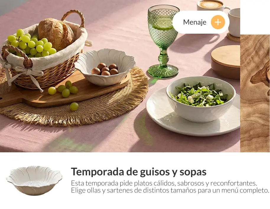 Menaje de cocina con vajilla, alimentos y accesorios sobre mesa en ambiente cálido para temporada de invierno