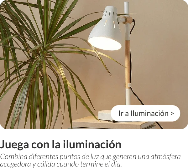 Lámpara de escritorio blanca estilo nórdico encendida junto a una planta